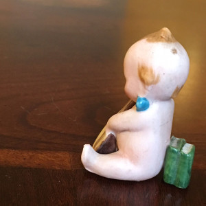 Back of Action Kewpie With Mandolin,, Showing Books he Leans On